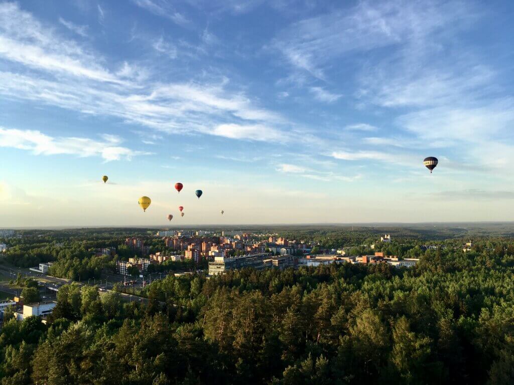 Hot air balloons over Vilnius at sunset